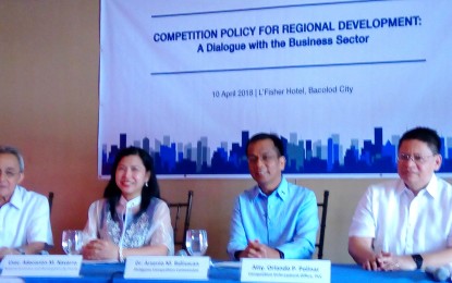 <p>PCC Chairman Arsenio Balisacan  (second from left) with (from left) Metro Bacolod Chamber of Commerce and Industry chief executive officer Frank Carbon, NEDA Undersecretary Adoracion Navarro, and Director IV Orlando Polinar of the PCC Competition Enforcement Office during a forum in Bacolod City on Tuesday (April 10, 2018). <em><strong>(Photo by Nanette L. Guadalquiver)</strong></em></p>